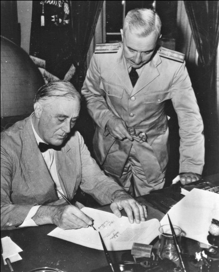 Surgeon General Thomas Parran witnessing President Franklin Delano Roosevelt signing the Bolton Act into law.