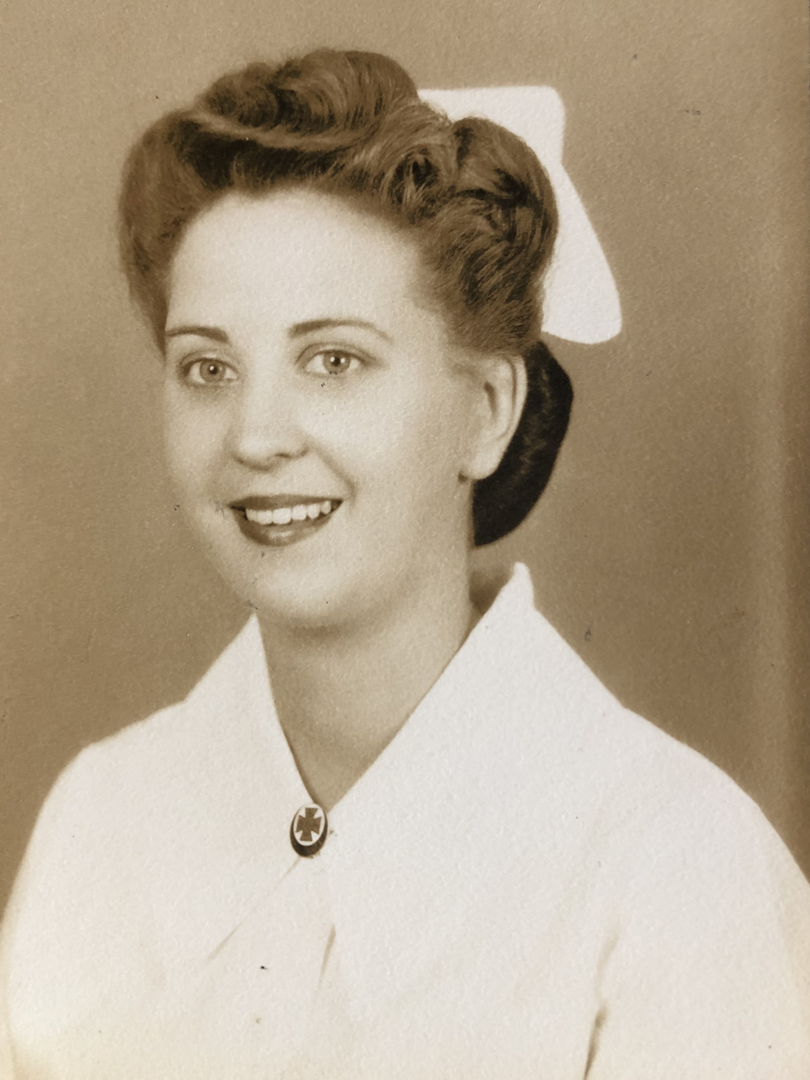 Beverly in hospital whites